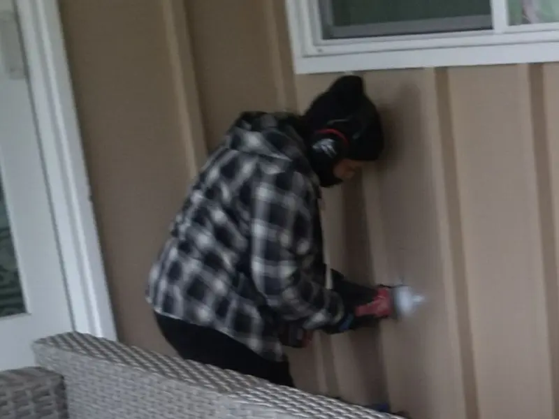 Professional electrician installing an exterior outlet in Florence