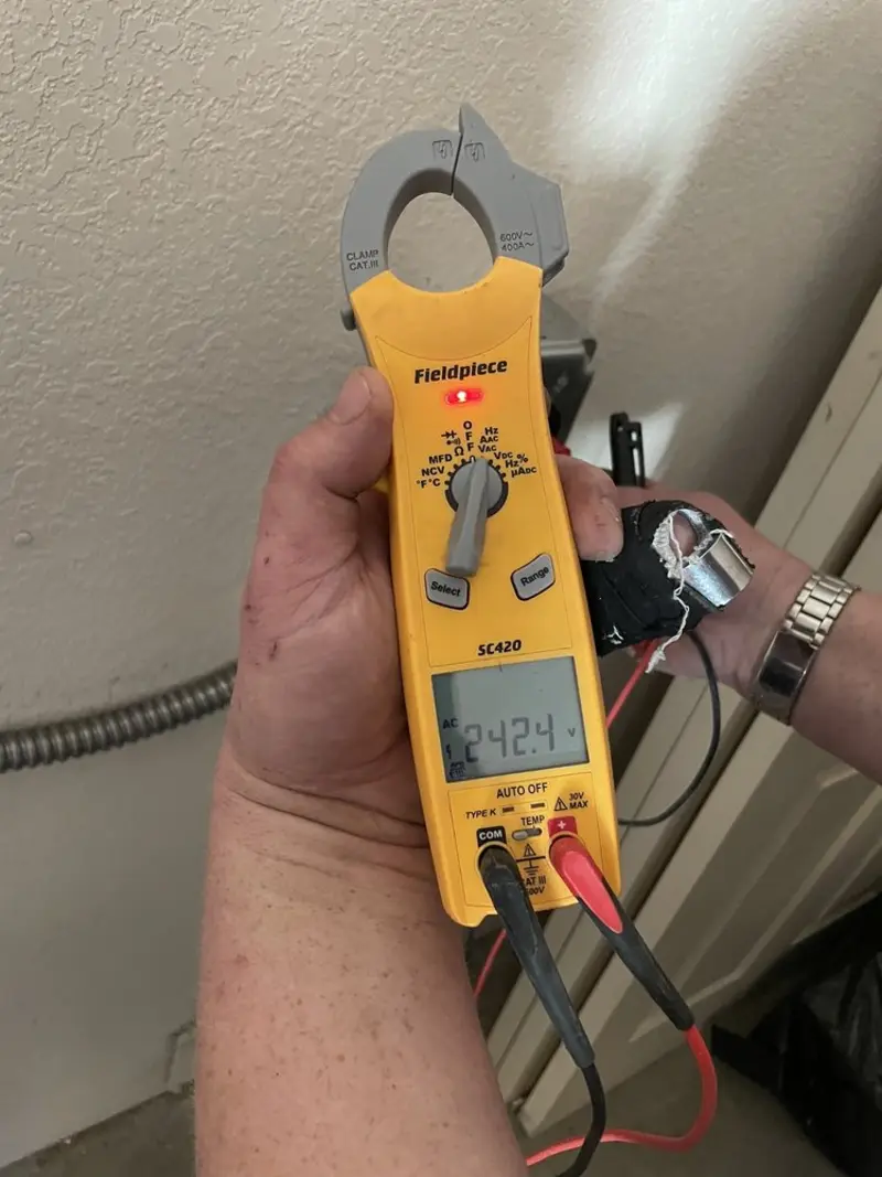 Voltage testing with clamp meter during Generator Installation in Florence